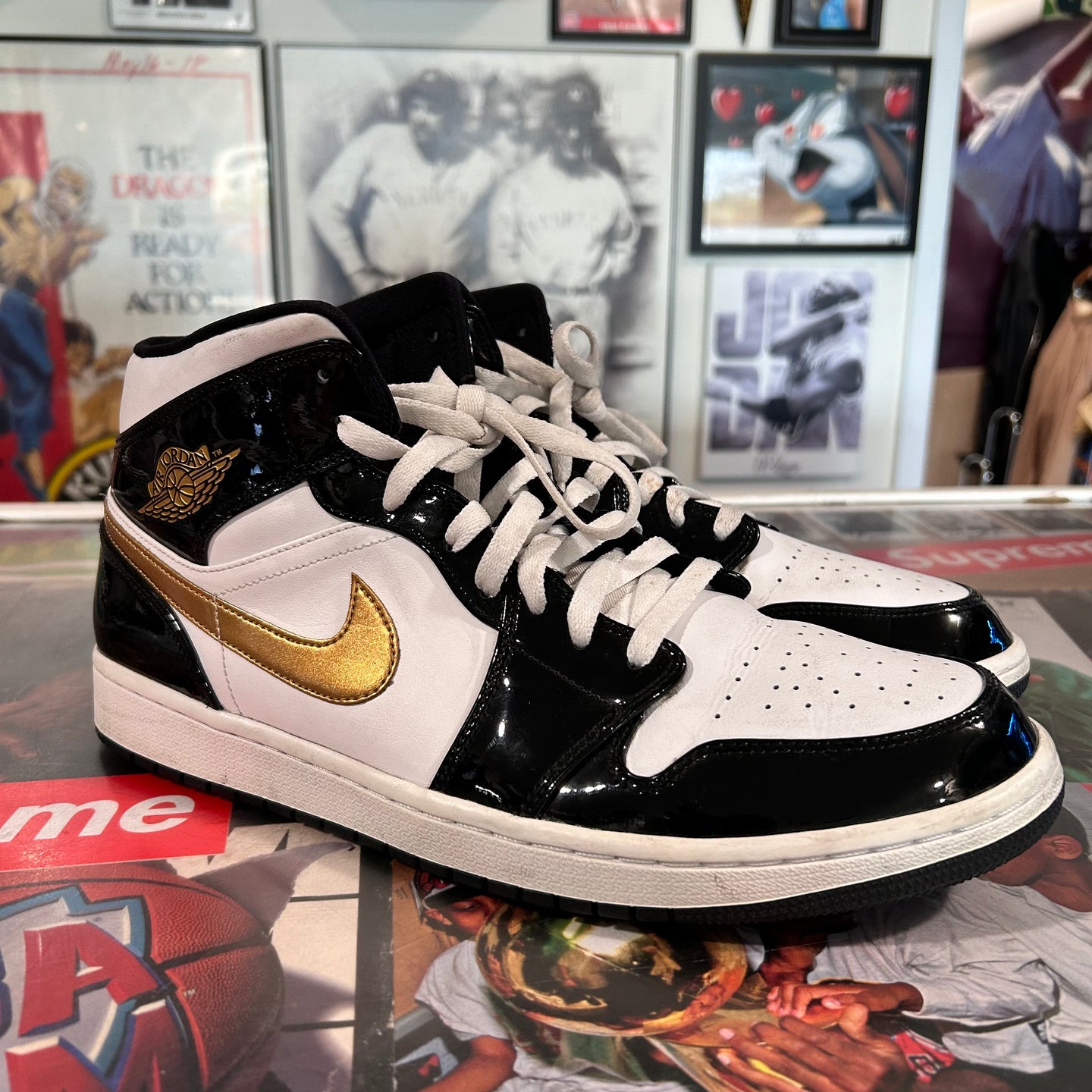 Black and gold Jordan 1 mids