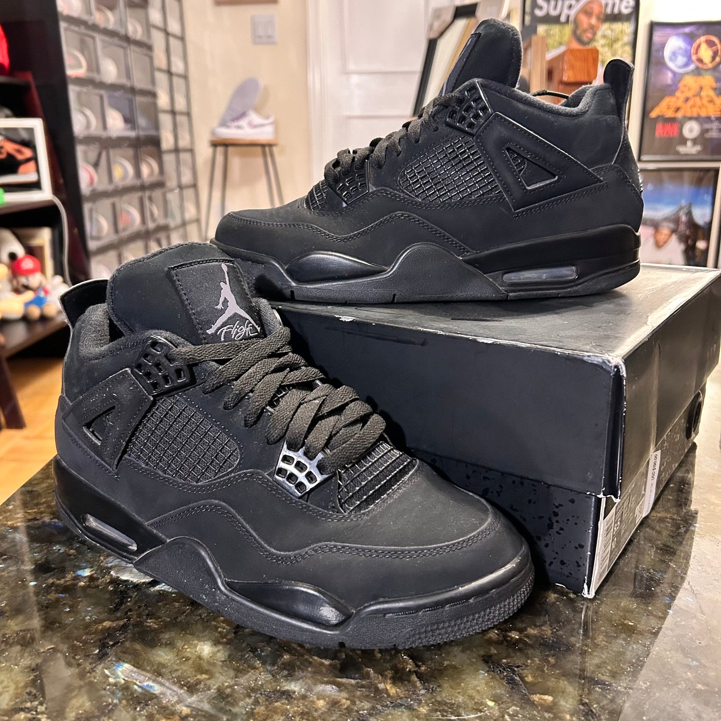 Black Cat Jordan 4’s