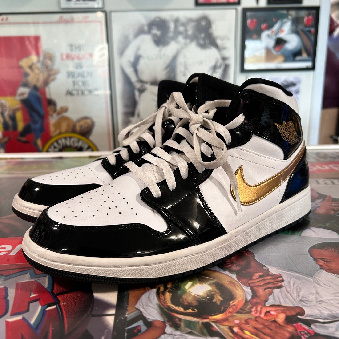 Black and gold Jordan 1 mids